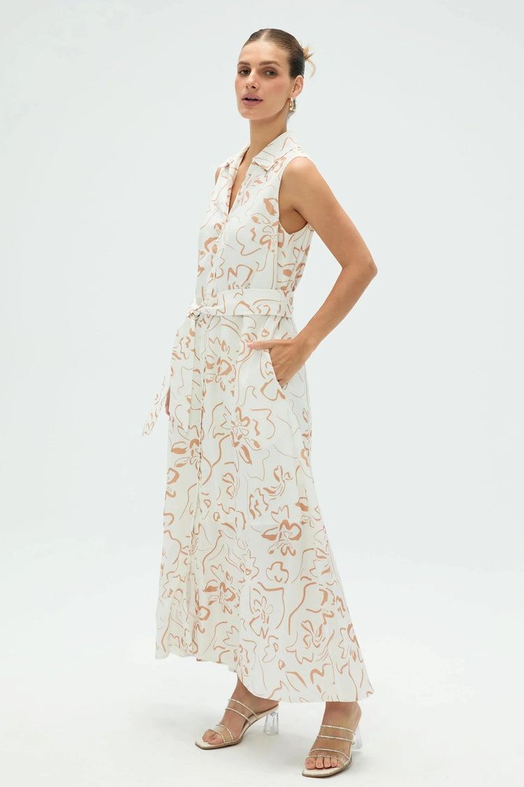 Side view of women’s sand bloom sleeveless shirt dress showing flowing silhouette