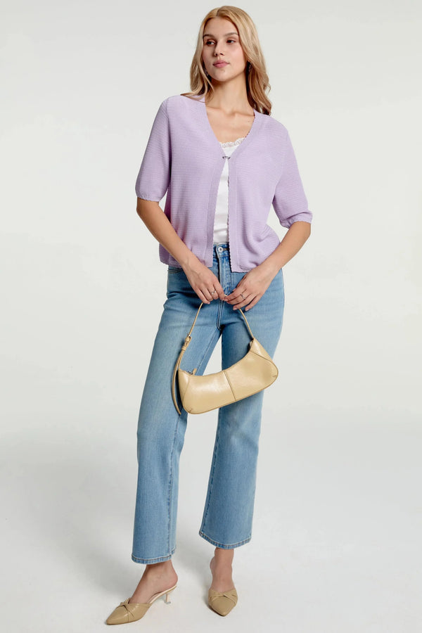 Women’s soft knit hook-front cardigan styled with blue jeans, full-body front view