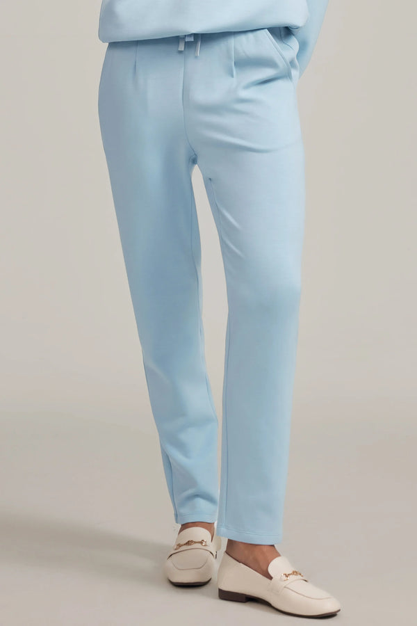Front view of powder blue Tencel™ lounge pants featuring a high-waisted, tapered silhouette