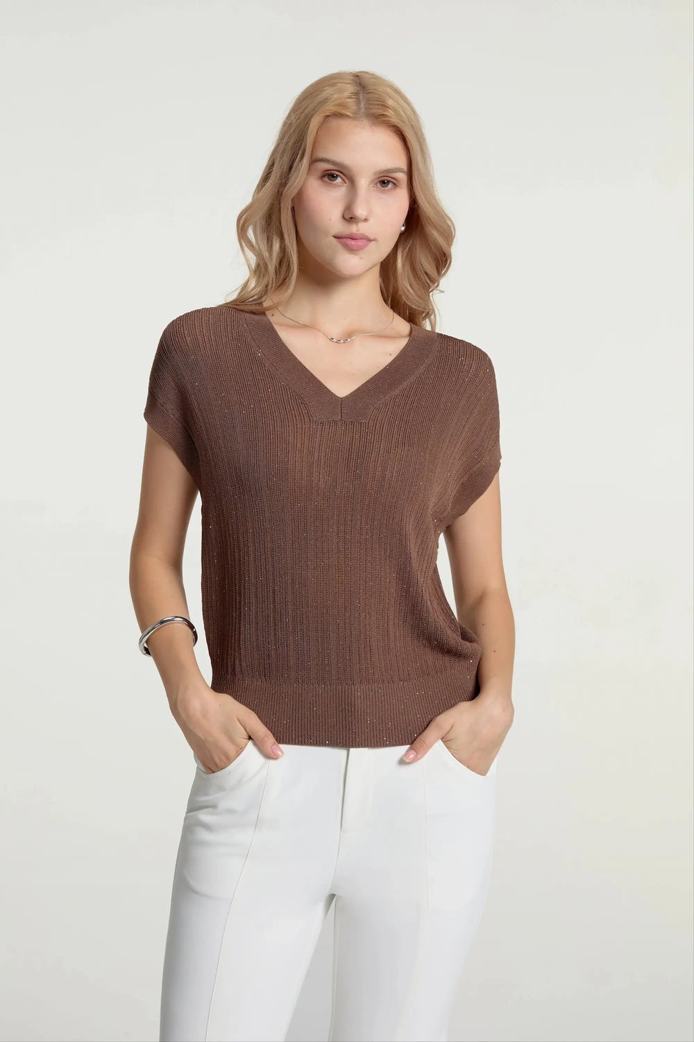 Women’s espresso luxe sparkle ribbed knit V-neck top styled with white pants, upper-body front view