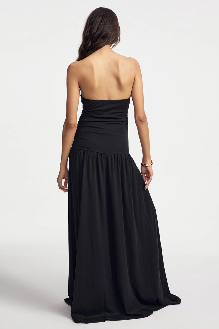 Back view of women’s black strapless maxi dress
