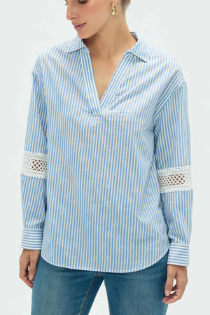 Close-up view of women’s striped popover blouse highlighting refined fabric and detailing