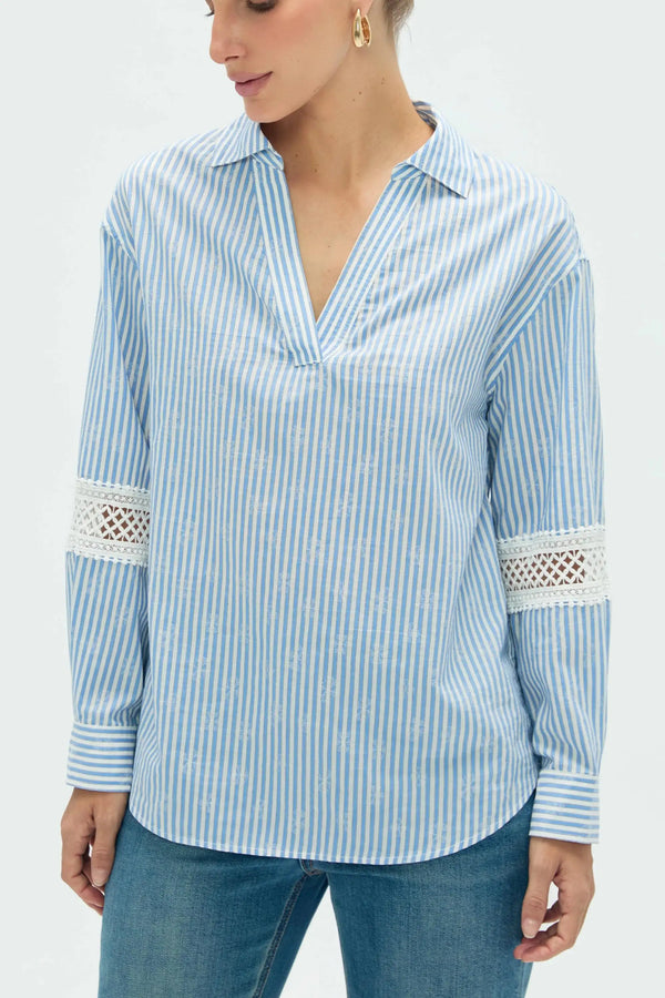 Close-up view of women’s striped popover blouse highlighting refined fabric and detailing