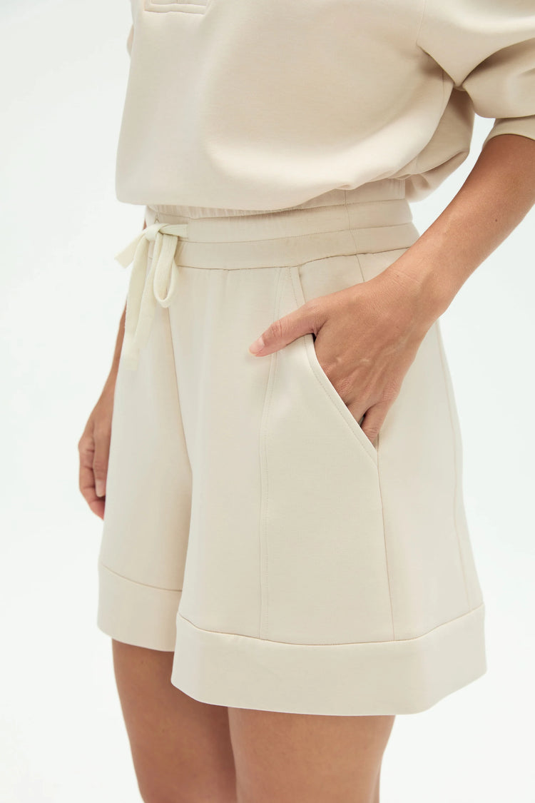 Close-up of the side pocket detail on soft wool-blend structured lounge shorts