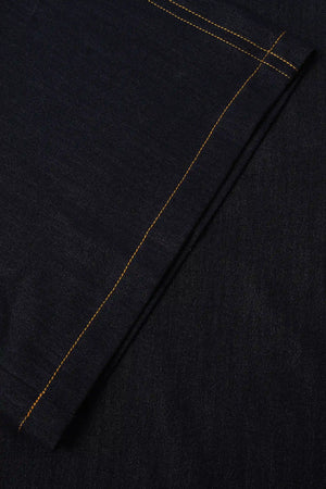 Close-up of the wide-leg hem detailing on tailored ink rinse denim