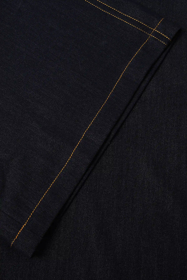 Close-up of the wide-leg hem detailing on tailored ink rinse denim