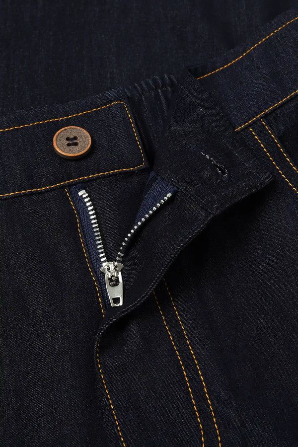 Close-up of the zip waist detail on high-rise tailored wide-leg denim