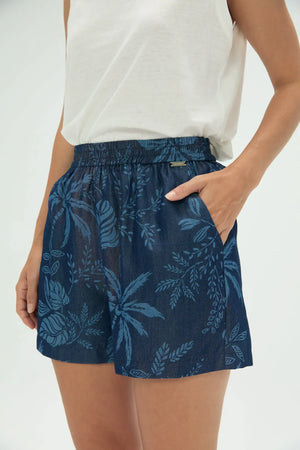 Side view of women’s indigo palm pull-on shorts showing pockets and relaxed fit