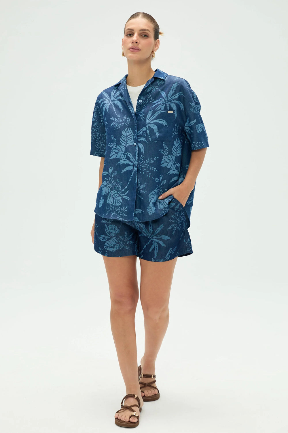 Women’s tropical relaxed button-up shirt styled with matching shorts, upper-body front view