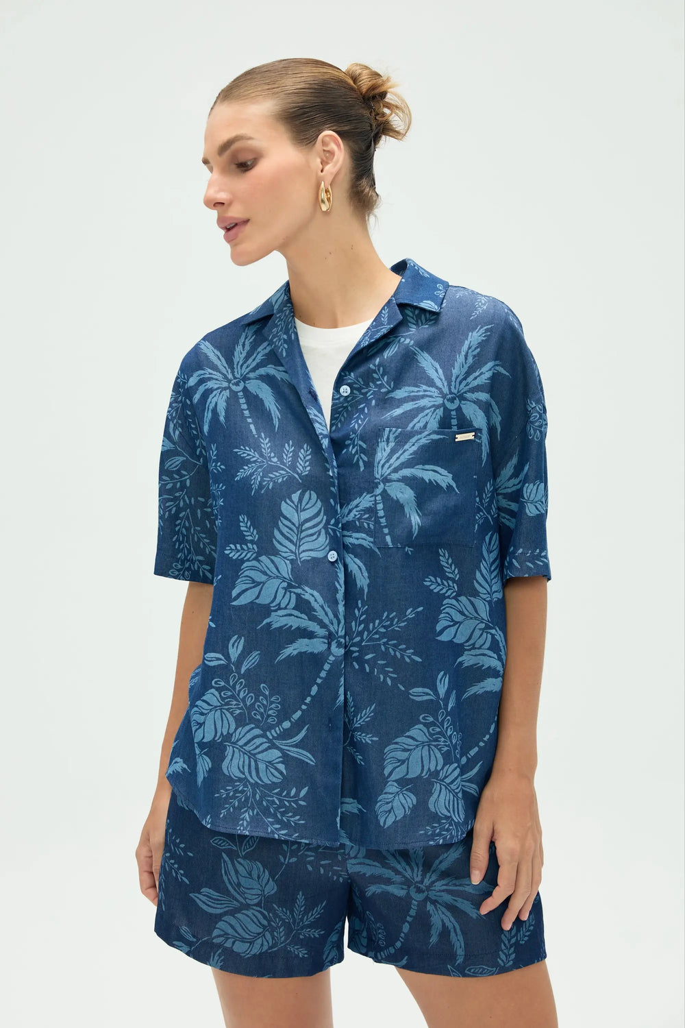 Women’s tropical relaxed button-up shirt styled with matching shorts, upper-body front view