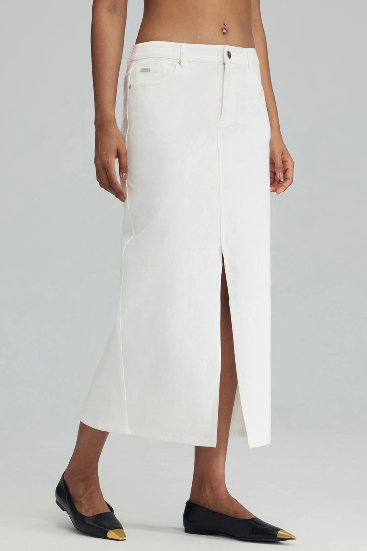 White stretch denim straight maxi skirt in classic white, shown from the side with clean lines and a tailored fit.