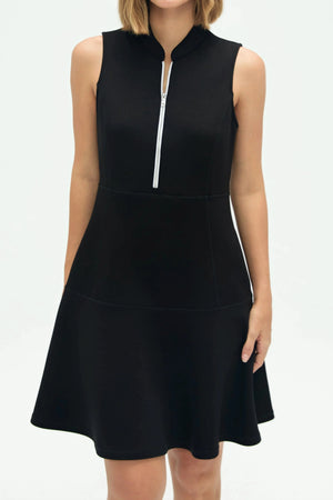 Close-up of jet black zip-collar flare dress showing skirt drape and structure
