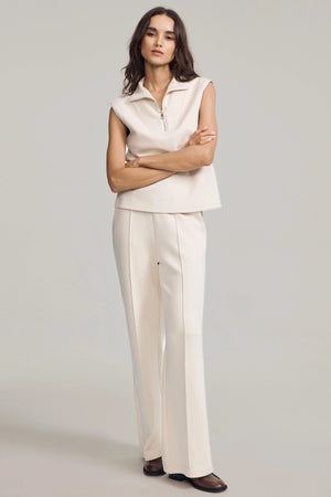 Cream sandshell sleeveless half-zip pullover designed for refined everyday wear