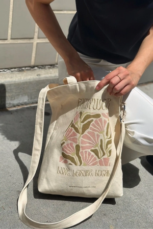 Handheld everyday canvas tote featuring the Wild Bloom botanical print, front view
