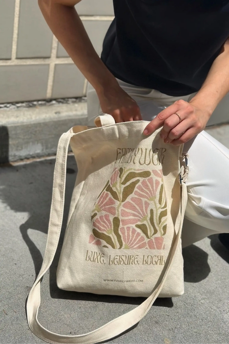 Handheld everyday canvas tote featuring the Wild Bloom botanical print, front view