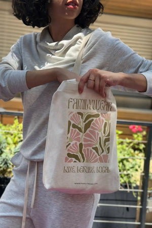 Structured cotton canvas tote with Wild Bloom print worn over the shoulder