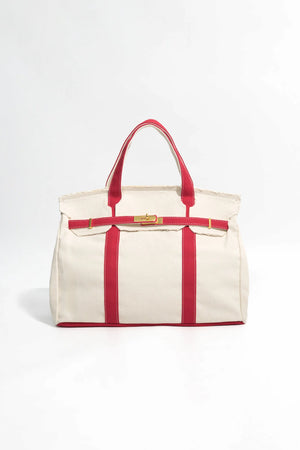 Handcrafted canvas tote in red featuring a durable cotton construction, front view