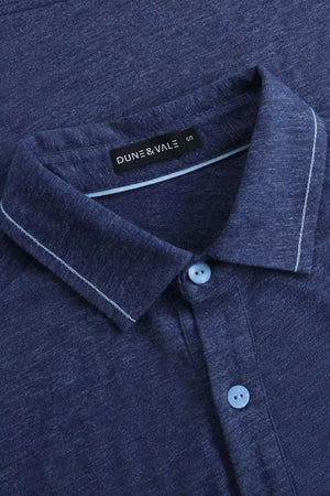Close-up of the collar detail on a men’s maritime blue cotton-Tencel long-sleeve polo.