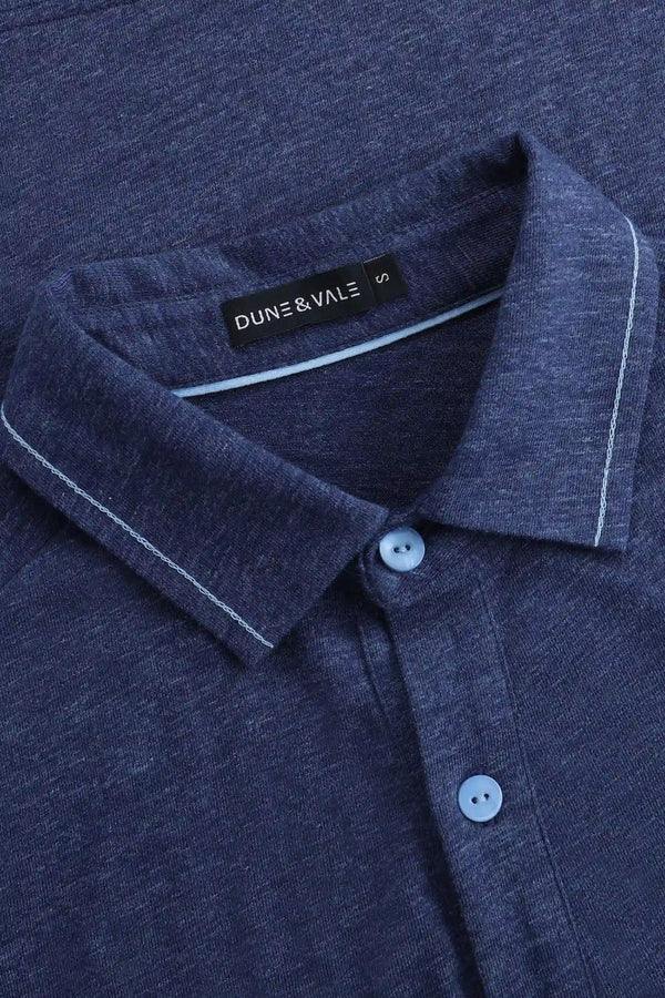 Close-up of the collar detail on a men’s maritime blue cotton-Tencel long-sleeve polo.