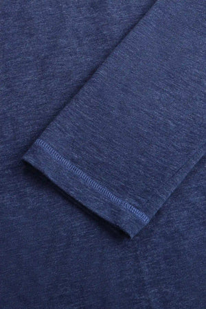 Detail view of the cuff on a men’s maritime blue cotton-Tencel long-sleeve polo, designed for a polished look.