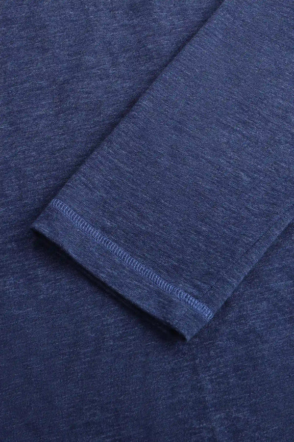 Detail view of the cuff on a men’s maritime blue cotton-Tencel long-sleeve polo, designed for a polished look.