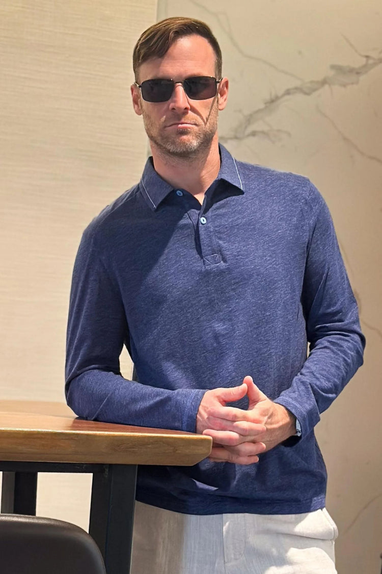 Front view of a men’s maritime blue cotton-Tencel long-sleeve polo with a clean, modern fit.