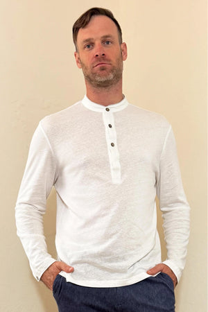 Front view of a men’s alpine white linen–Supima button-neck henley with a modern mandarin collar and clean, streamlined fit.