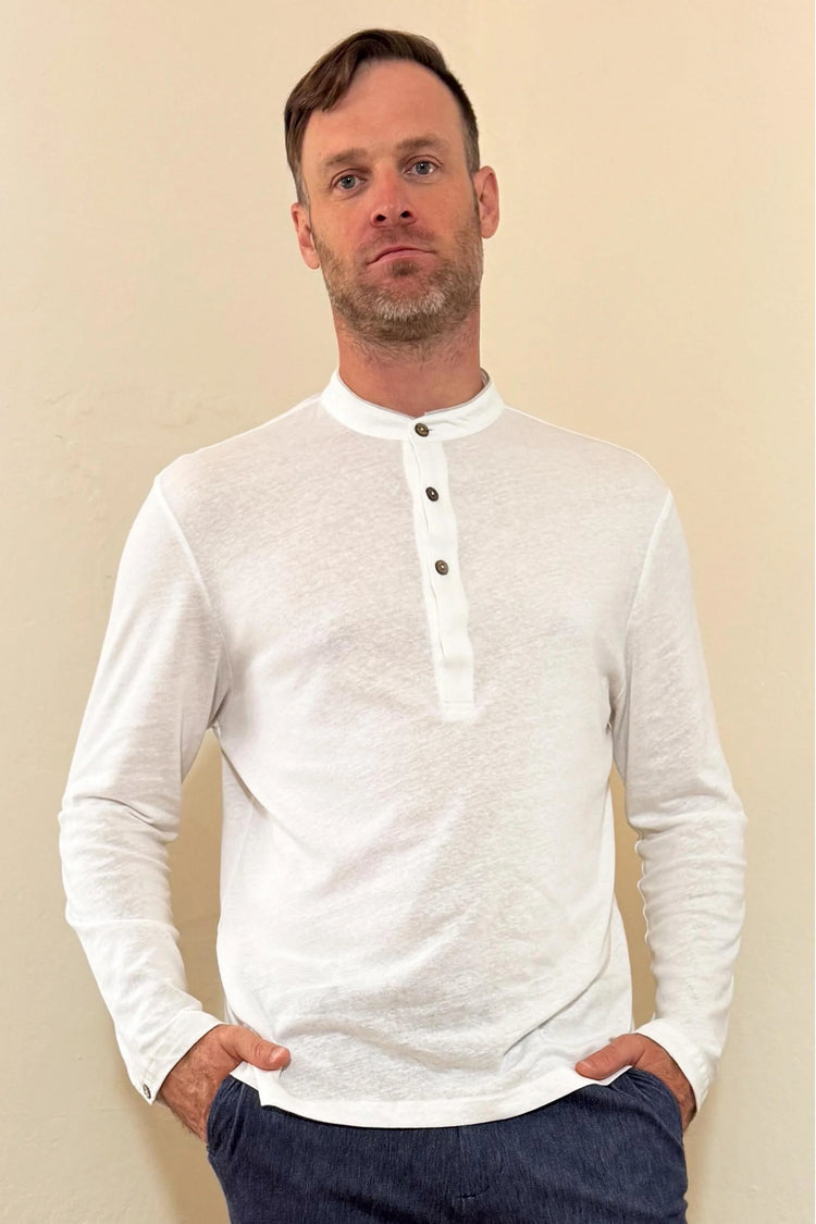 Front view of a men’s alpine white linen–Supima button-neck henley with a modern mandarin collar and clean, streamlined fit.