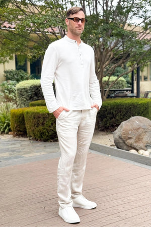 Men’s alpine white linen–Supima button-neck henley styled with linen pants for a relaxed, refined everyday look.