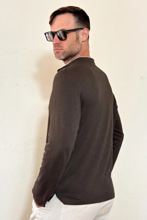 Angled back view of a men’s espresso linen–Supima button-neck henley with a refined, everyday silhouette.