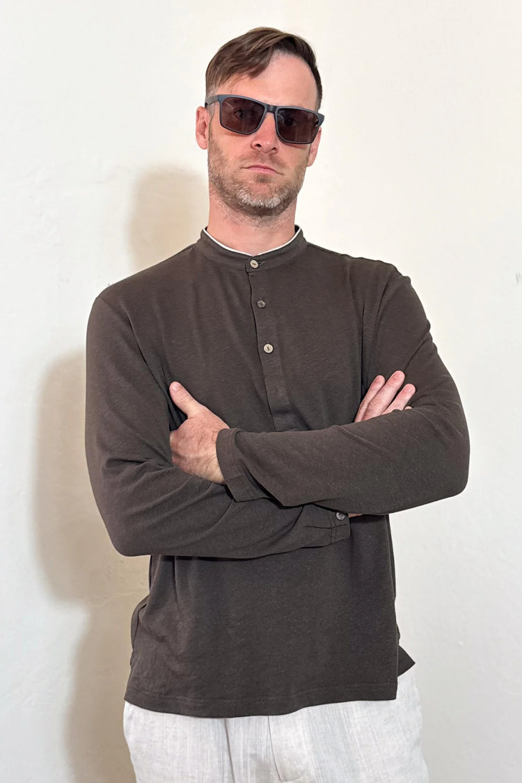 Front view of a men’s espresso linen–Supima button-neck henley with a modern mandarin collar and clean, streamlined fit.