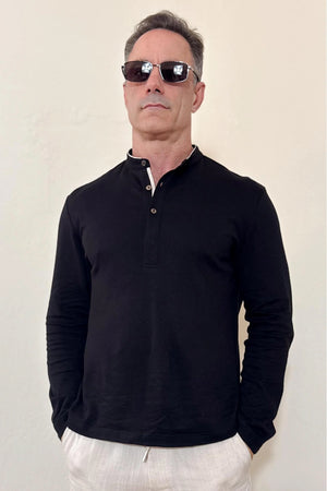 Front view of a men’s onyx black linen–Supima button-neck henley with a modern mandarin collar and clean, streamlined fit.