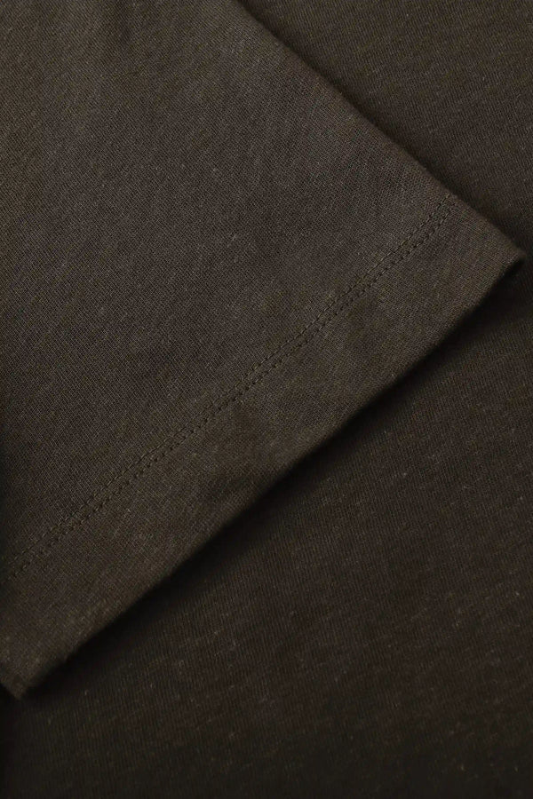 Detail view of the sleeve finish on a men’s espresso linen–Supima crewneck tee.