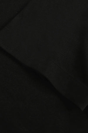 Detail view of the sleeve finish on a men’s jet black linen–Supima crewneck tee.