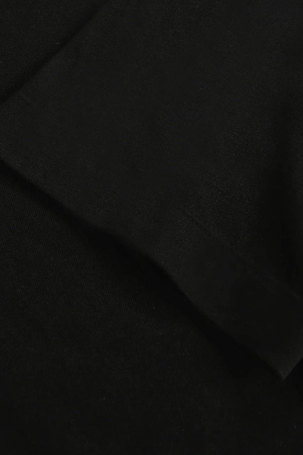 Detail view of the sleeve finish on a men’s jet black linen–Supima crewneck tee.