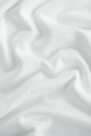 Close-up of the alpine white linen–Supima blend fabric, highlighting soft texture and breathable comfort.