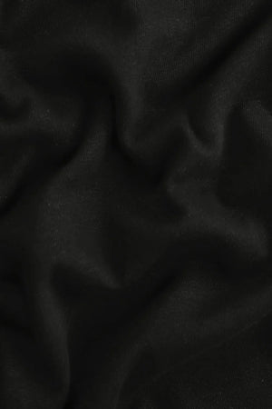 Close-up of the onyx black linen–Supima blend fabric, highlighting breathable texture and soft hand feel.
