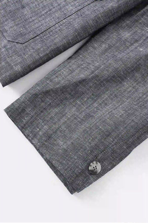 Detail view of the sleeve construction on a men’s heather grey linen-Tencel safari jacket.