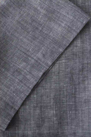 Close-up of the hem finish on men’s heather grey linen-Tencel tailored shorts, showing a clean, modern cut.