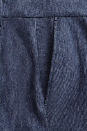 Close-up of the front pocket detail on men’s indigo rinse structured denim trousers, designed for everyday functionality.