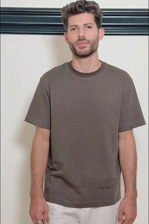 the video of a men’s espresso linen–Supima crewneck tee worn by a model for a polished everyday look.