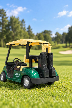 Rear three-quarter view of a green Veza Golf miniature golf cart featuring two black golf bags with miniature clubs on the course
