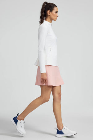 Side view of VEZA women’s white peplum mesh-panel zip jacket showing a sculpted, flattering fit