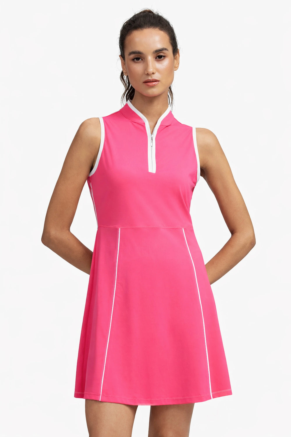 Woman wearing VEZA hot pink sleeveless half-zip golf dress with UPF 50+, front view