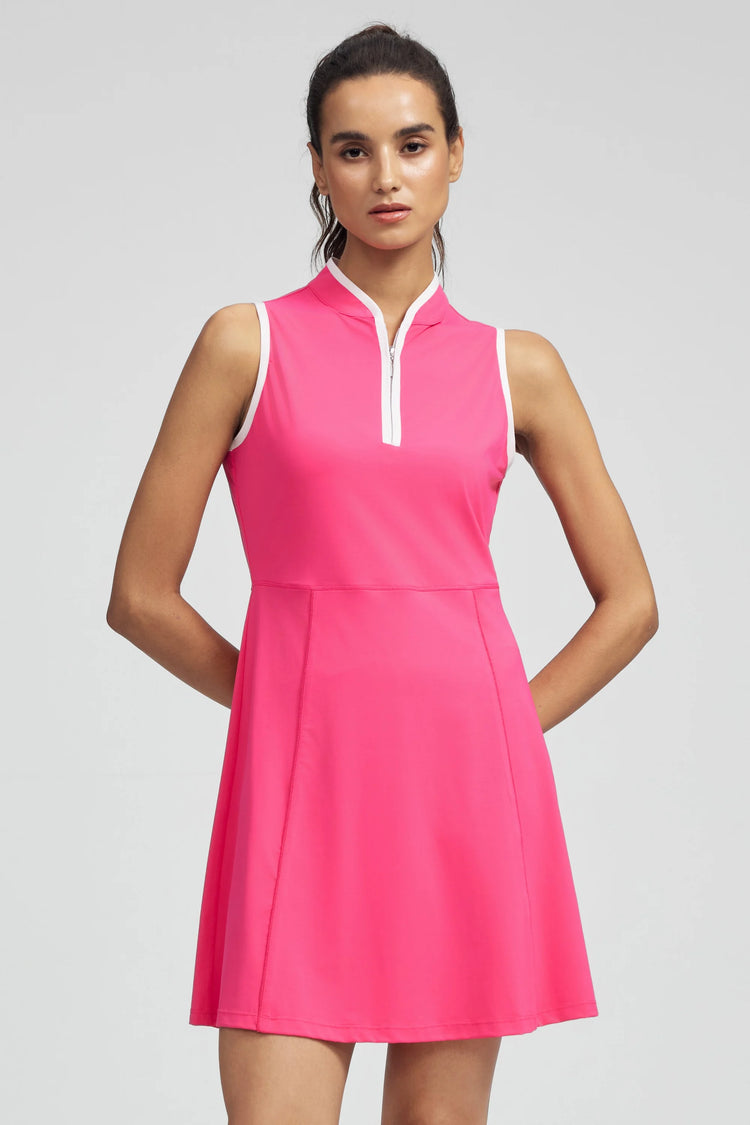 Woman wearing VEZA hot pink sleeveless half-zip golf dress with UPF 50+, front view