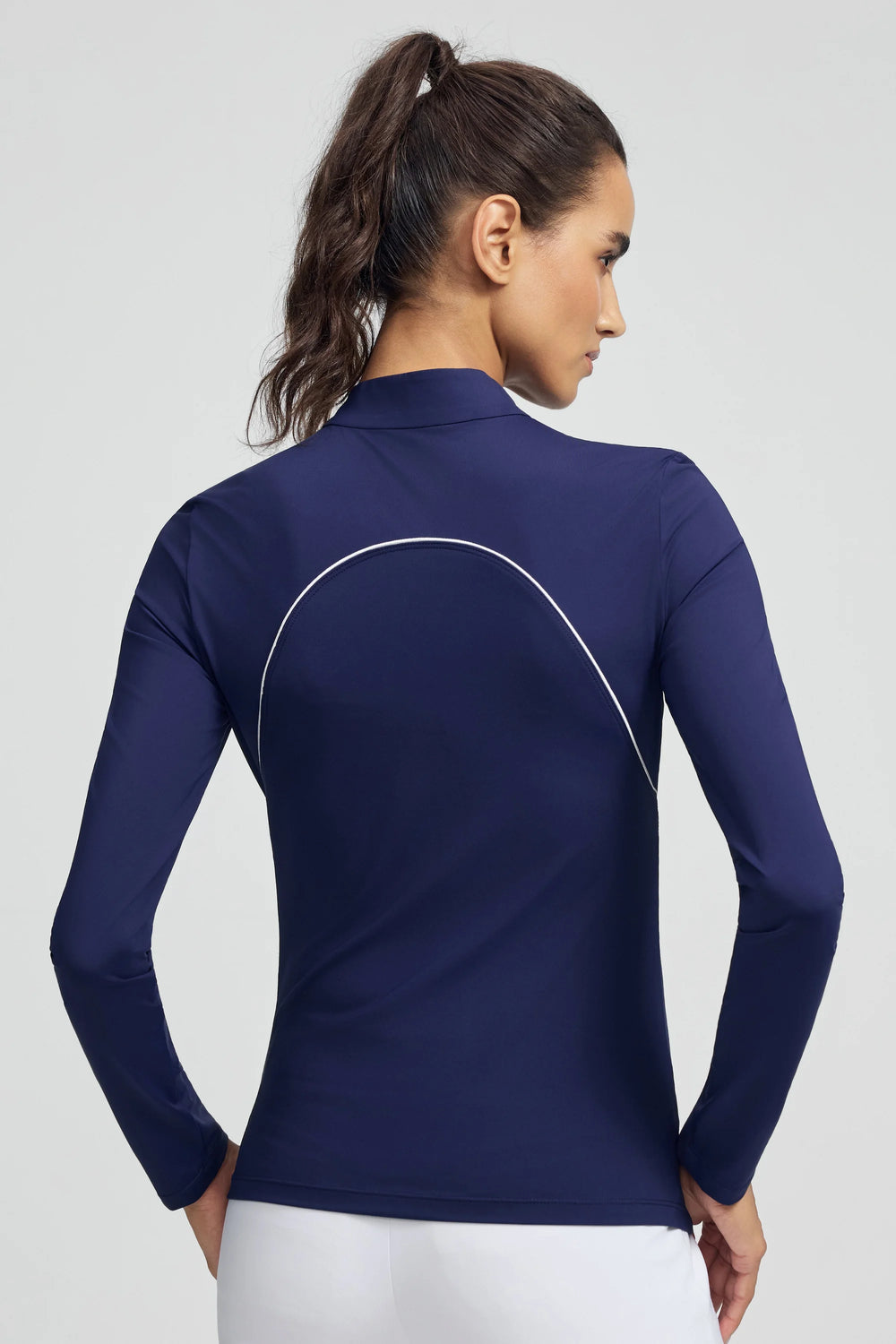 Woman wearing VEZA midnight swing navy blue piped quarter-zip performance top with UPF 50+, front view