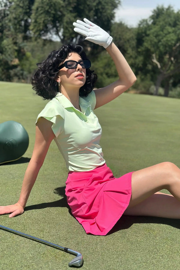 VEZA fairway mint ruffle-sleeve performance golf polo worn outdoors, breathable and moisture-wicking for relaxed off-course style
