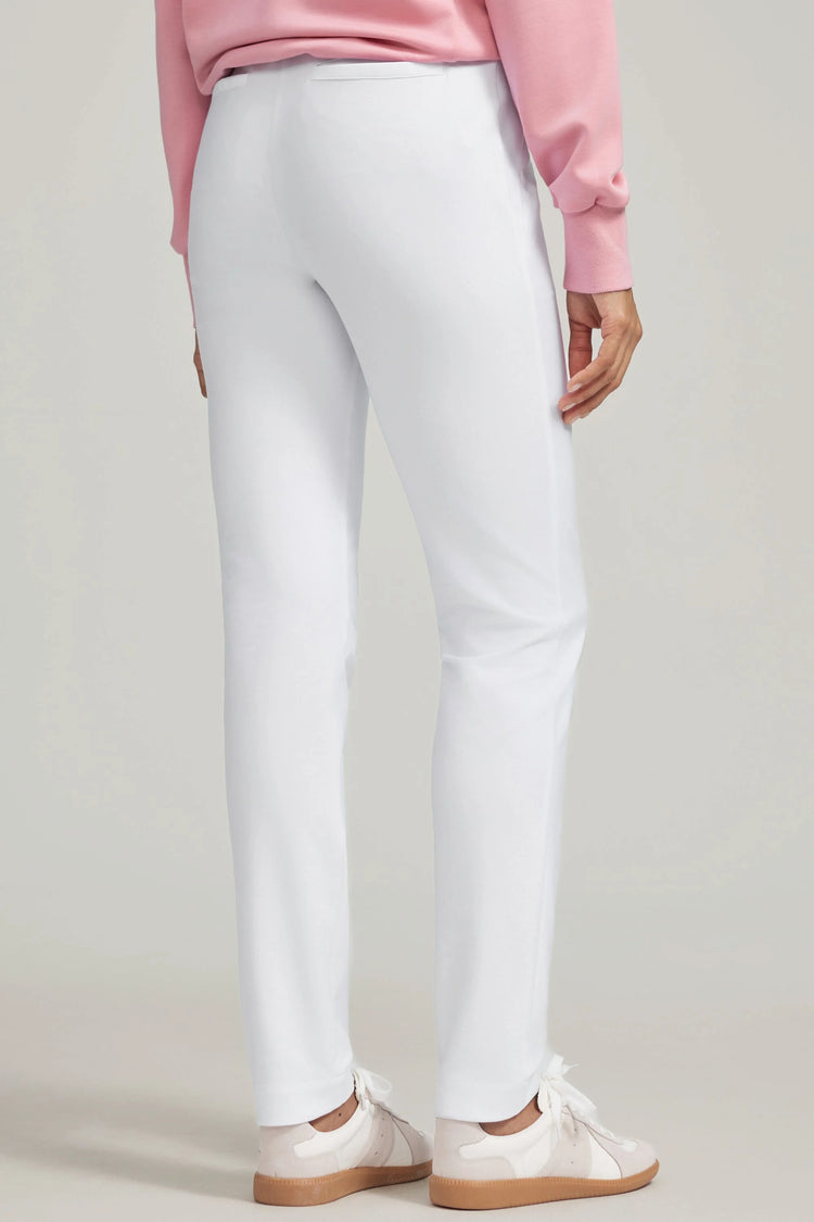 Back view of VEZA women’s cloudline white stretch performance pants with a clean, supportive fit