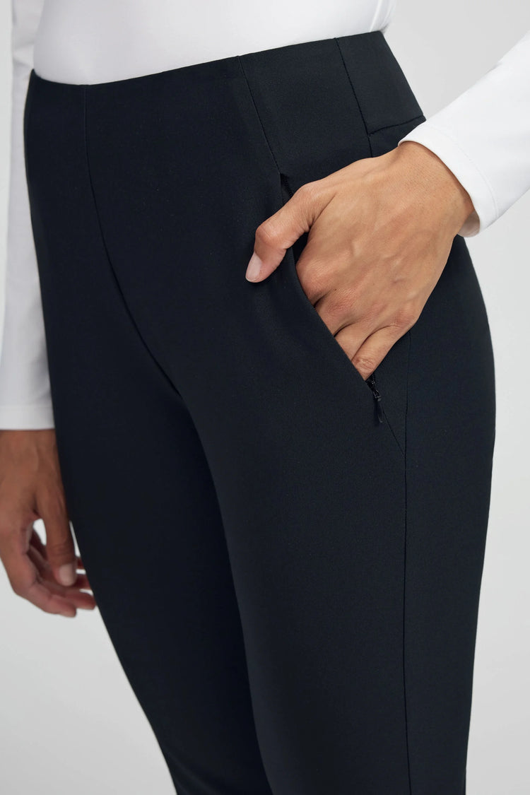 Close-up of VEZA onyx black performance pants highlighting secure zip-pocket construction
