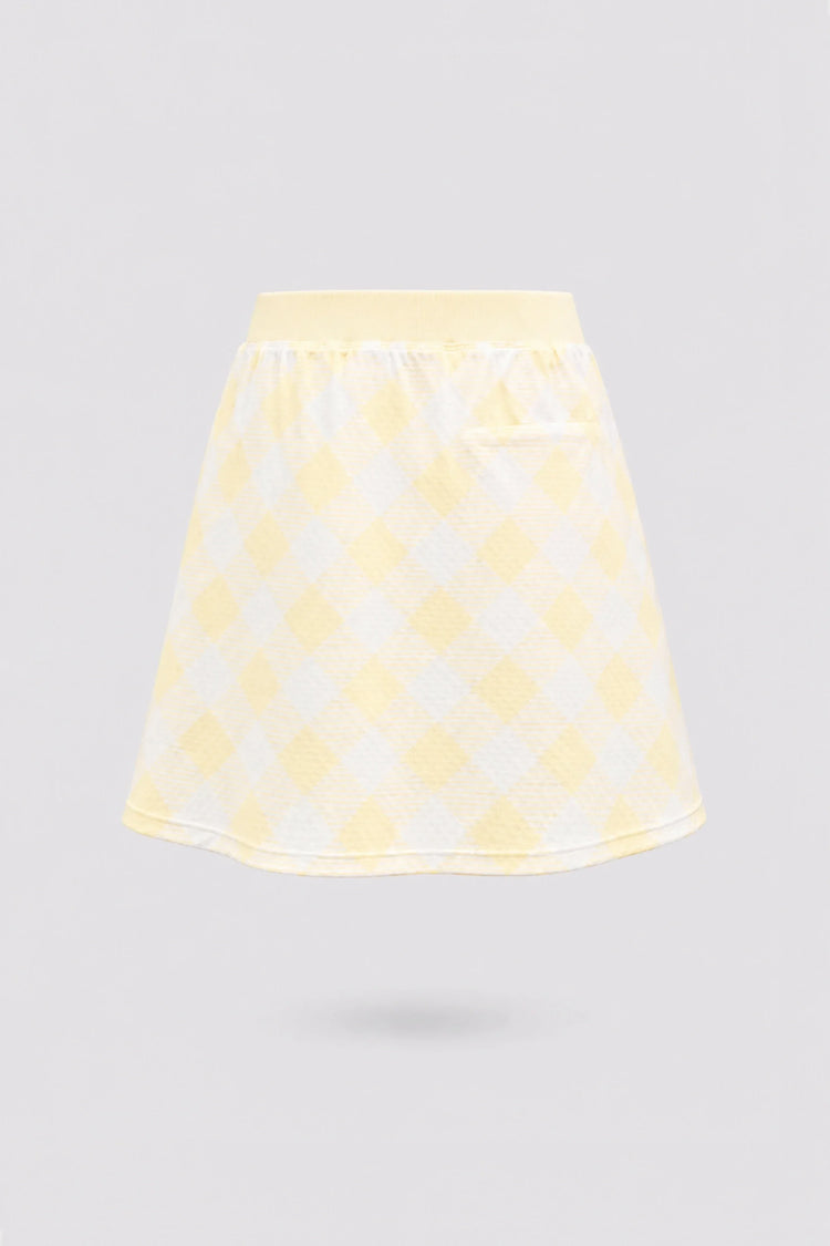 Back view of women’s yellow gingham golf skort with a flattering A-line fit and comfortable waistband